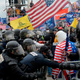 Riot police clash with pro-Trump rioters outside the Capitol on Jan. 6, 2021.